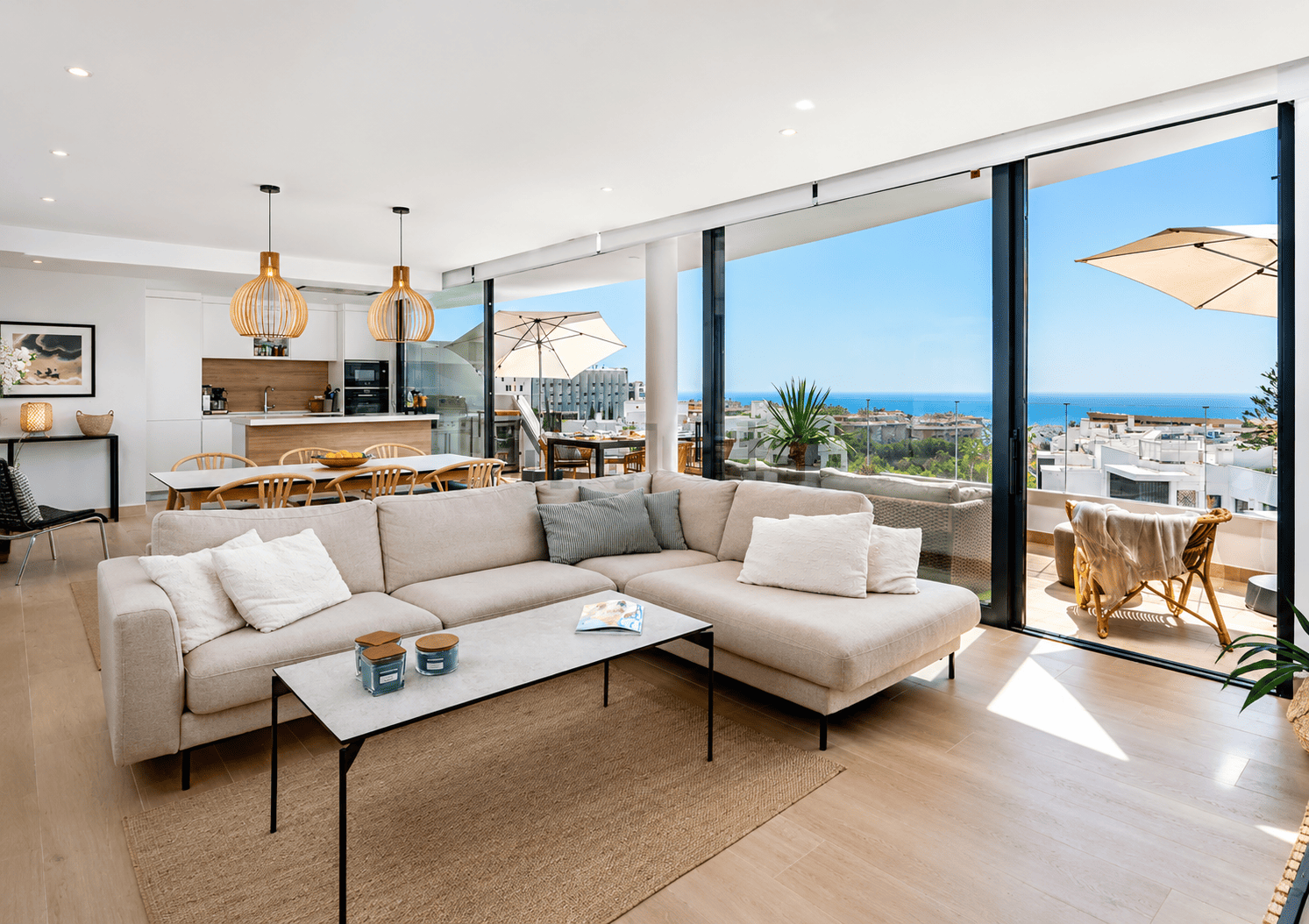 Bright living room with sectional sofa and floor-to-ceiling windows